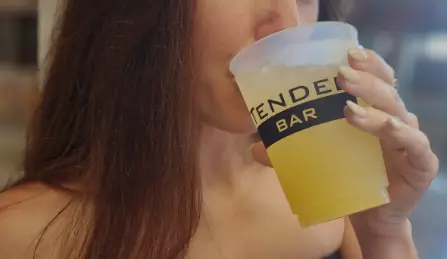 guest enjoying beverage that has the perfect amount of ingredients