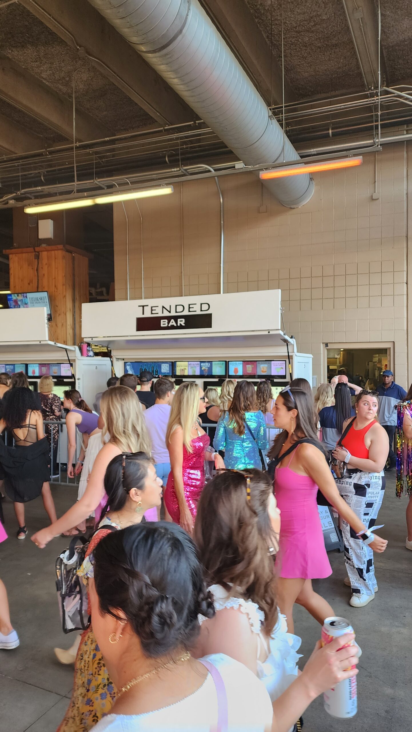 Crowd of guests queuing at TendedBar self-service beverage kiosks during high-volume event