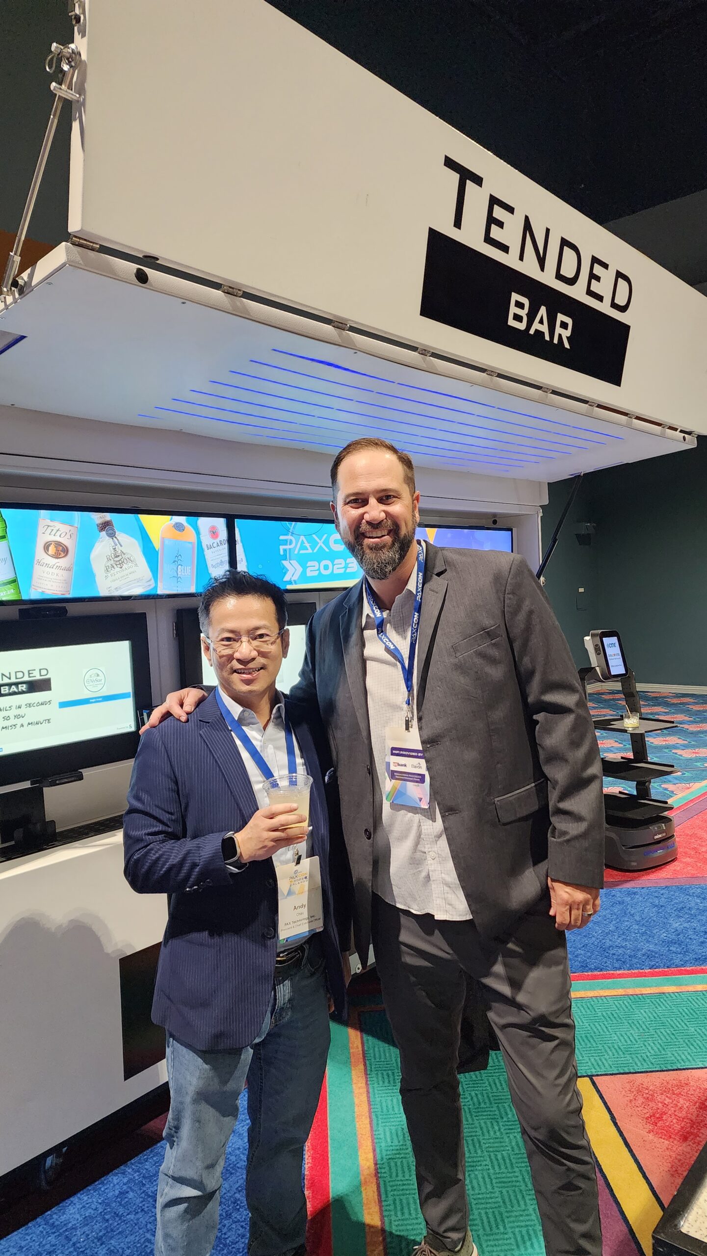 TendedBar business partners in professional attire at beverage automation deployment